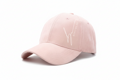 Pink baseball cap with a logo on a white background