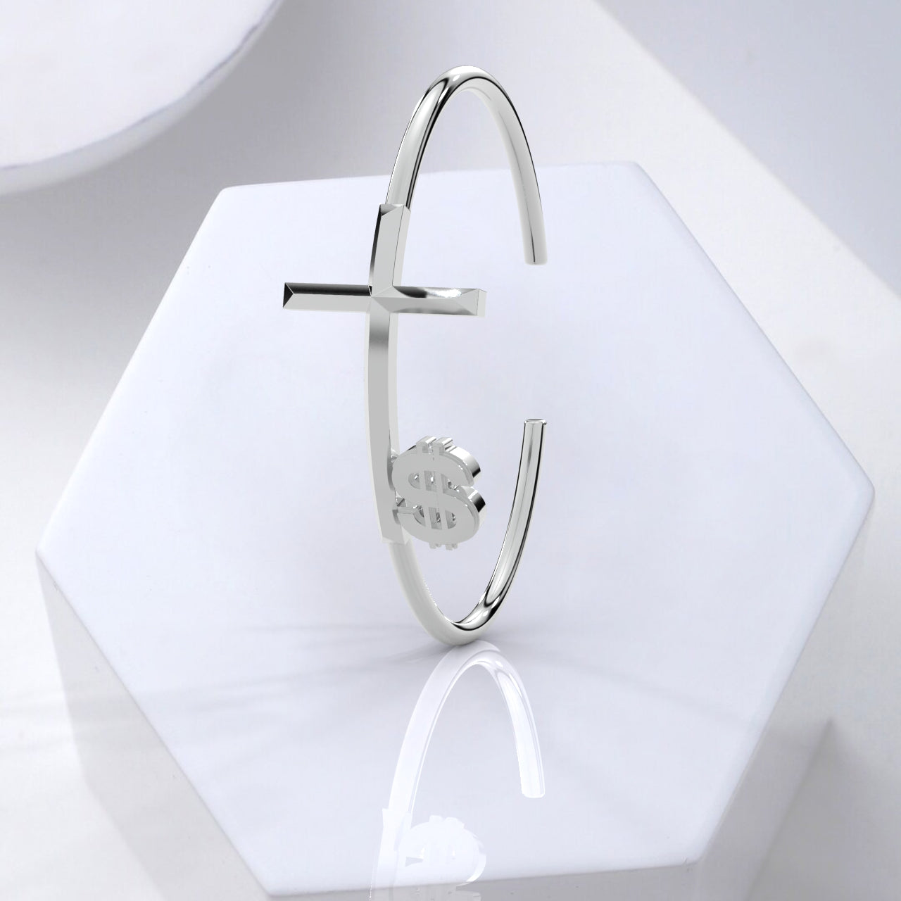 Silver safety pin brooch on a hexagonal white stand with a light gray background