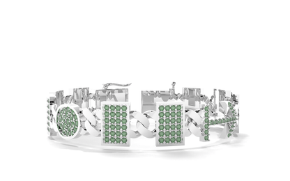 Silver bracelet with green gemstones on a white background