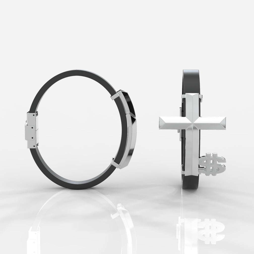 Silver ring with black band and cross design on a white background