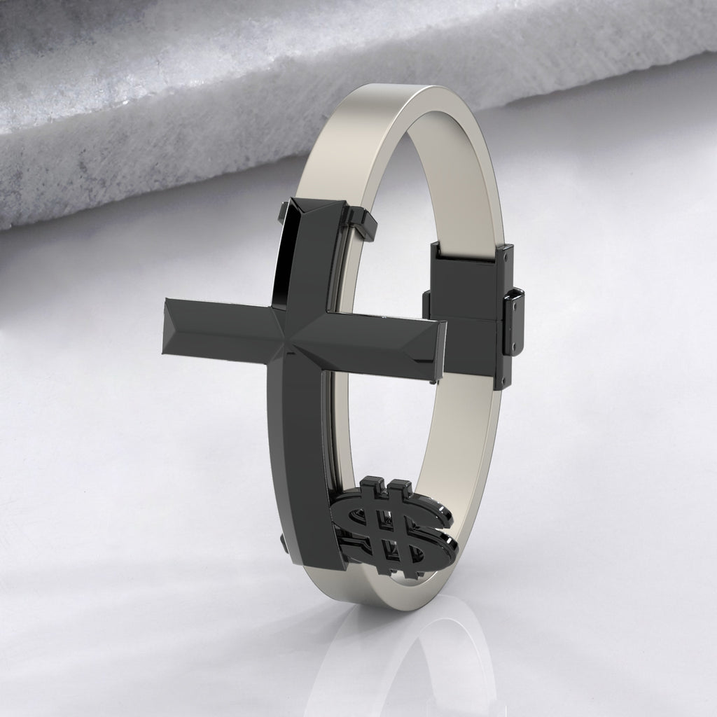 Silver bracelet with a black cross on a light gray background
