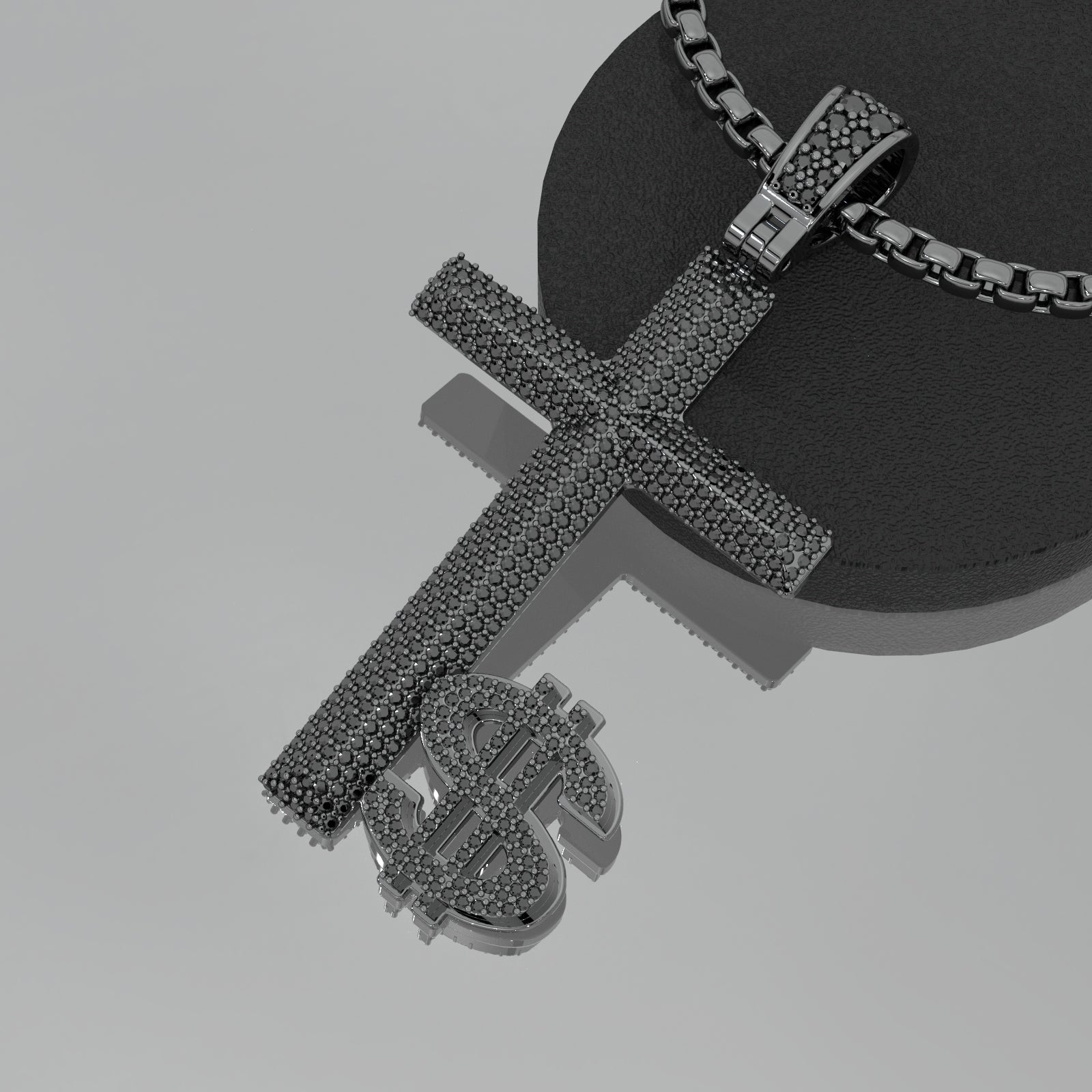Black cross-shaped pendant with dollar sign on a gray background