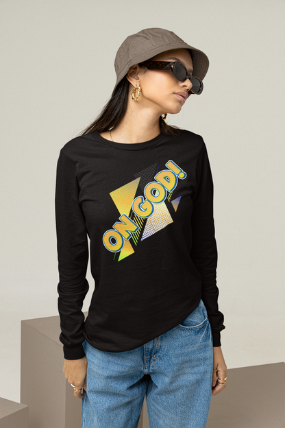 Person wearing a black long-sleeve shirt with colorful text, blue jeans, and a cap.