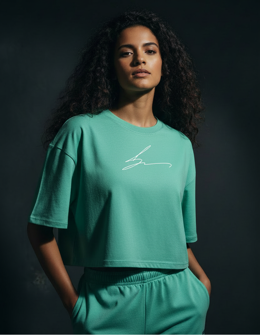 Mint green boxy fit cropped tee with script signature logo in white