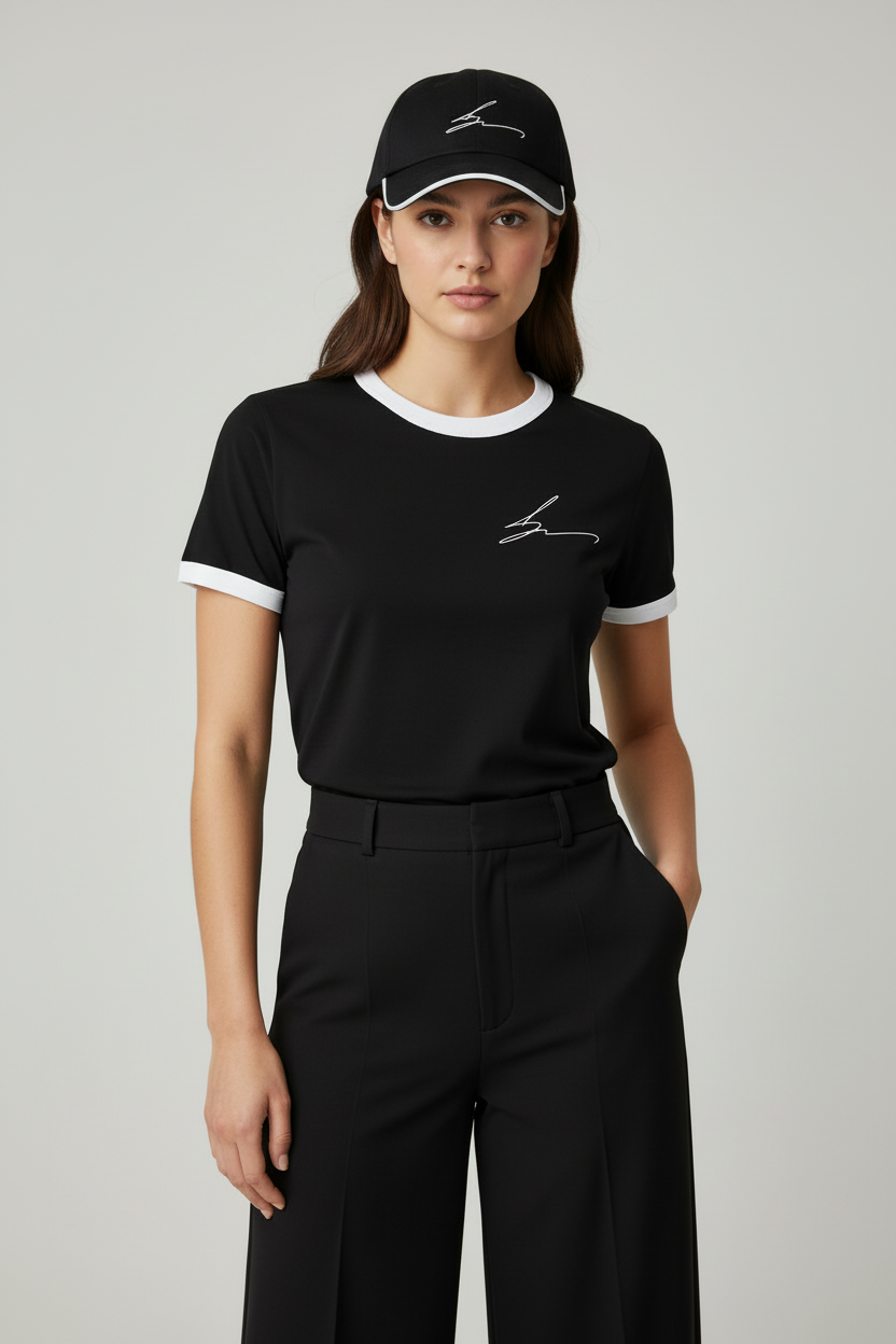 Model with black ringer tee and matching baseball cap